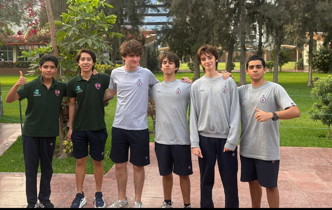 Six members of the Refract team standing together outdoors at their school in Lima